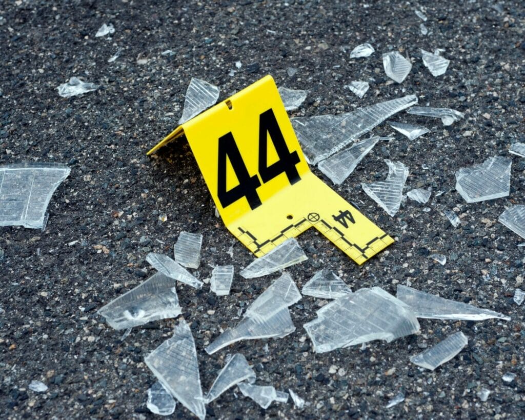 Rose Sander Law Firm - Preserving Evidence and Seeking Justice; A police tape with the number 44 on it laying on the ground.