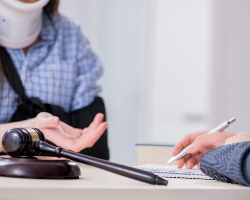 A lawyer is talking to a woman with a gavel.