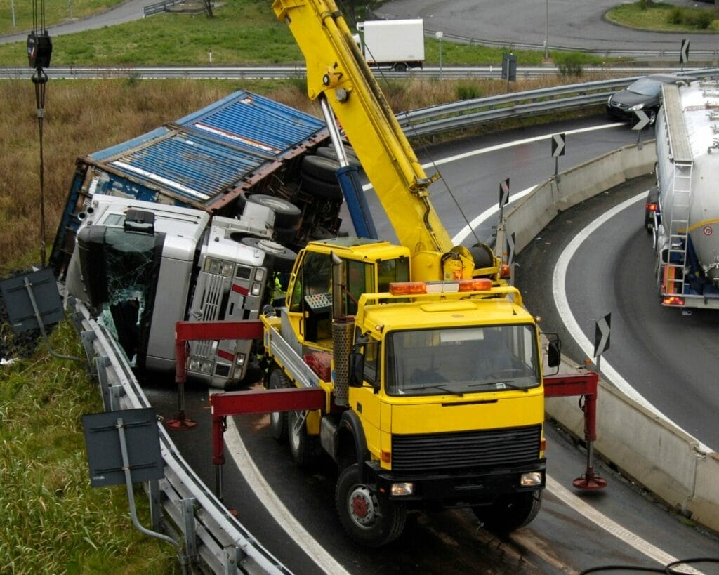 Rose Sanders law Firm - Truck Accident in Houston; A yellow truck on the side of the road.